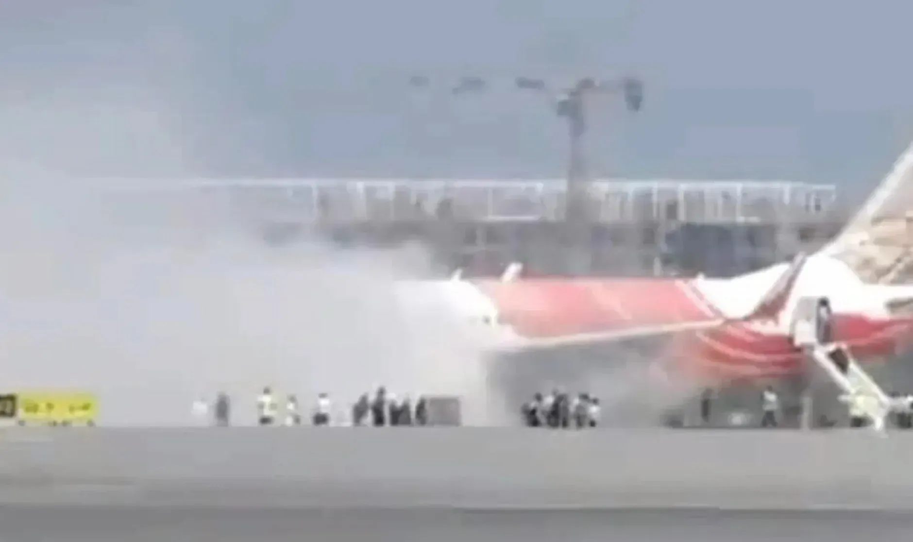 air india plane power unit catches fire in landing at delhi airport